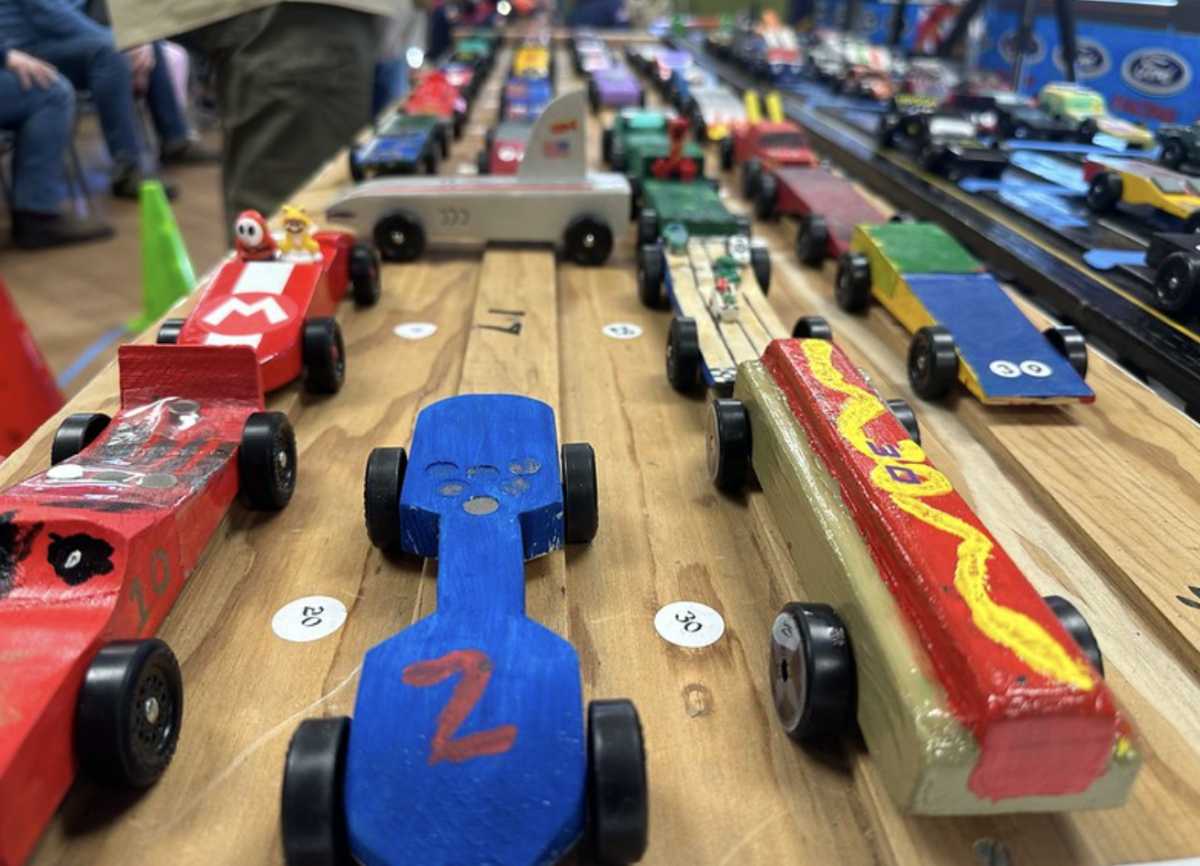 A series of creative wooden derby cars, created by scouts