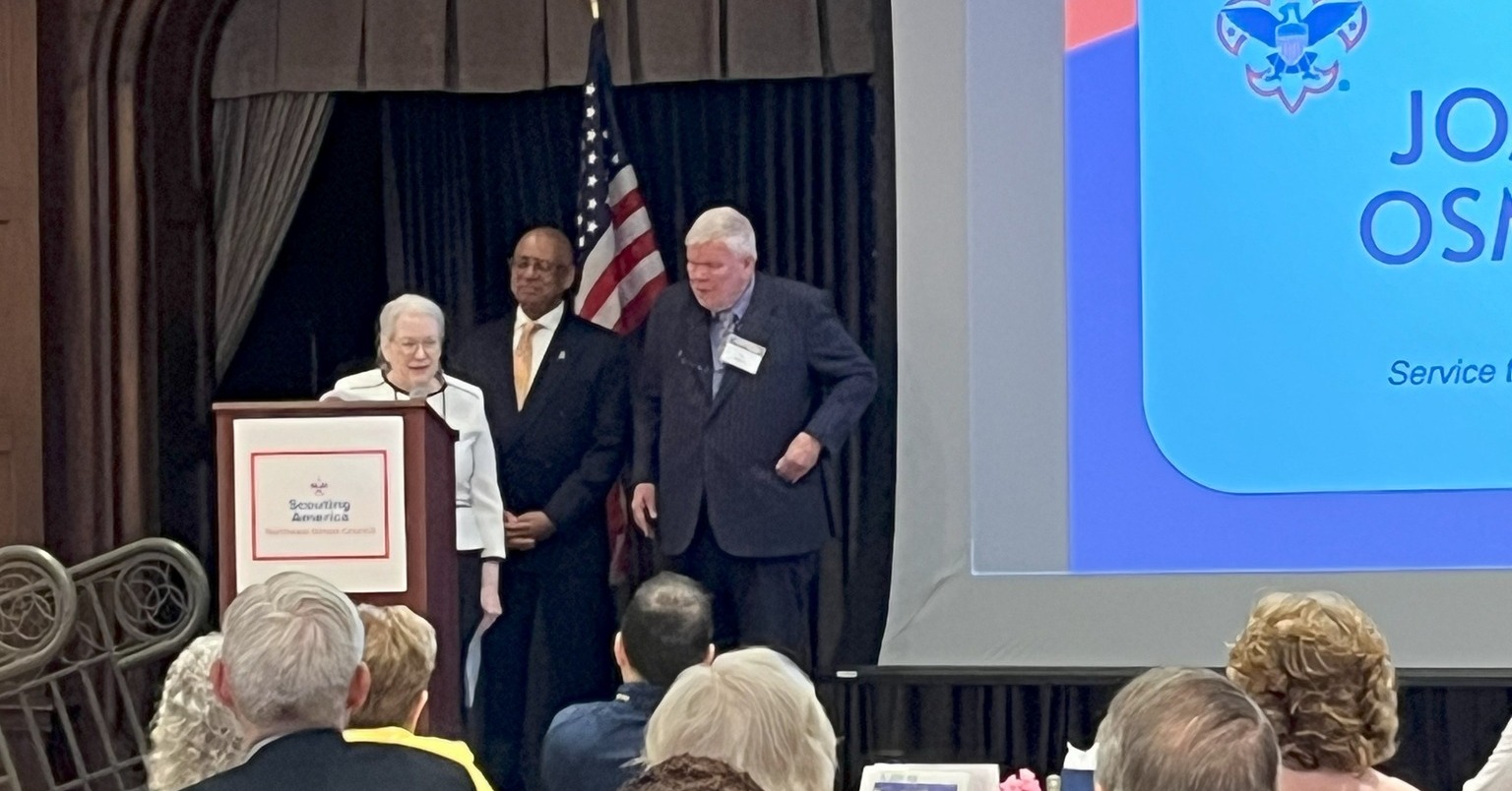 Joanne Osmond receives the 2025 Whitney M. Young Award on stage